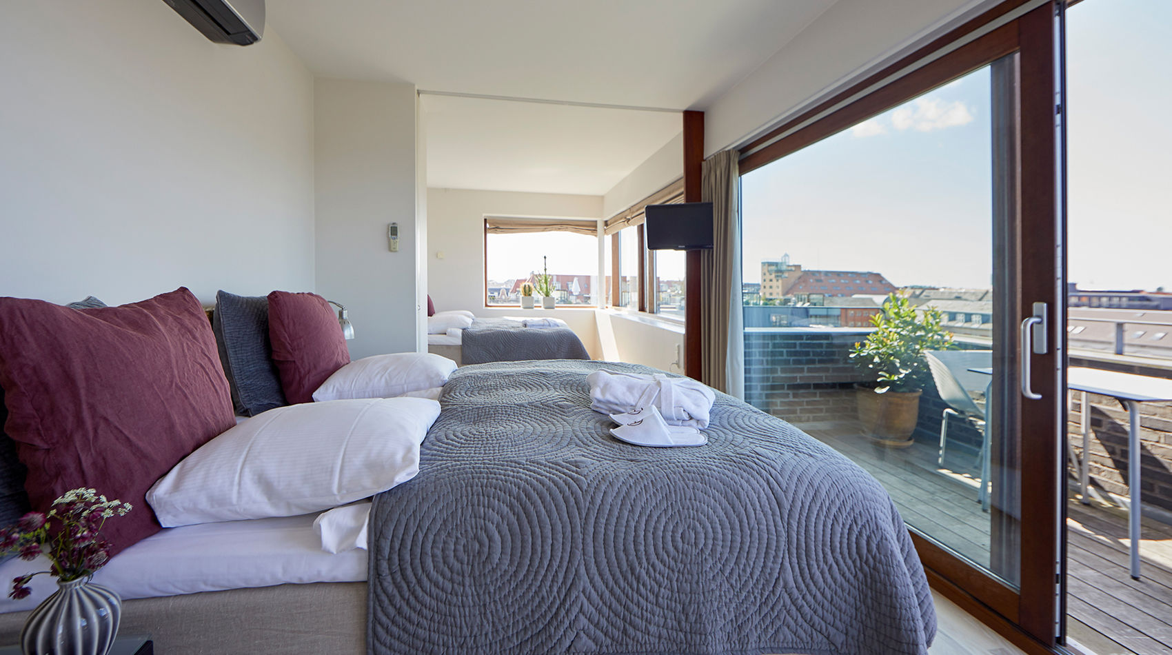 to soveværelser i penthouse hotellejlighed i København
